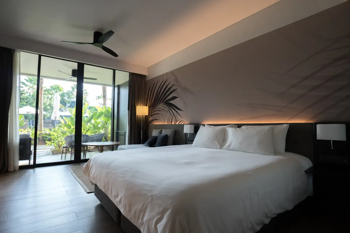 Spacious hotel room prepared for a relaxed evening
